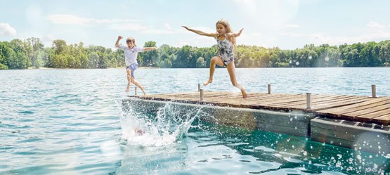 Children playing on a pier